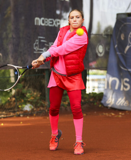 red puffa gilet for girls tennis by zoe alexander