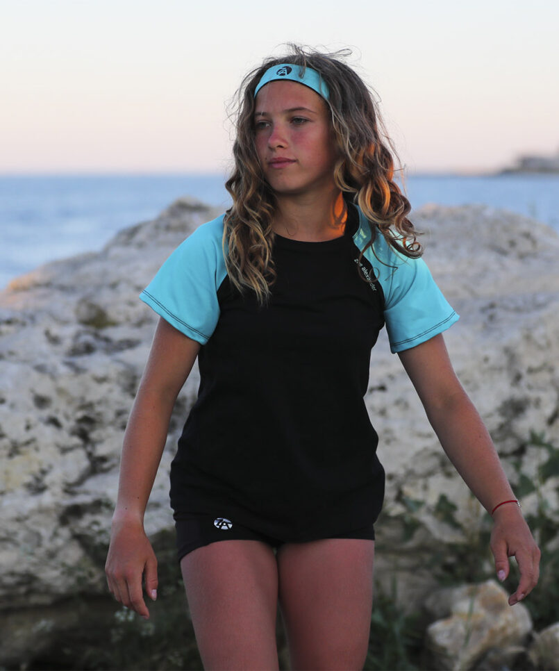 monica raglan tennis top in black and mint green